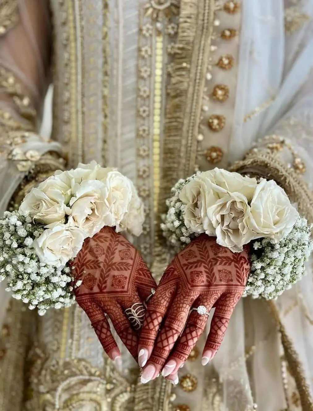 South Asian bride wearing traditional fresh flower bracelet and gajra jewelry for Toronto wedding ceremony
