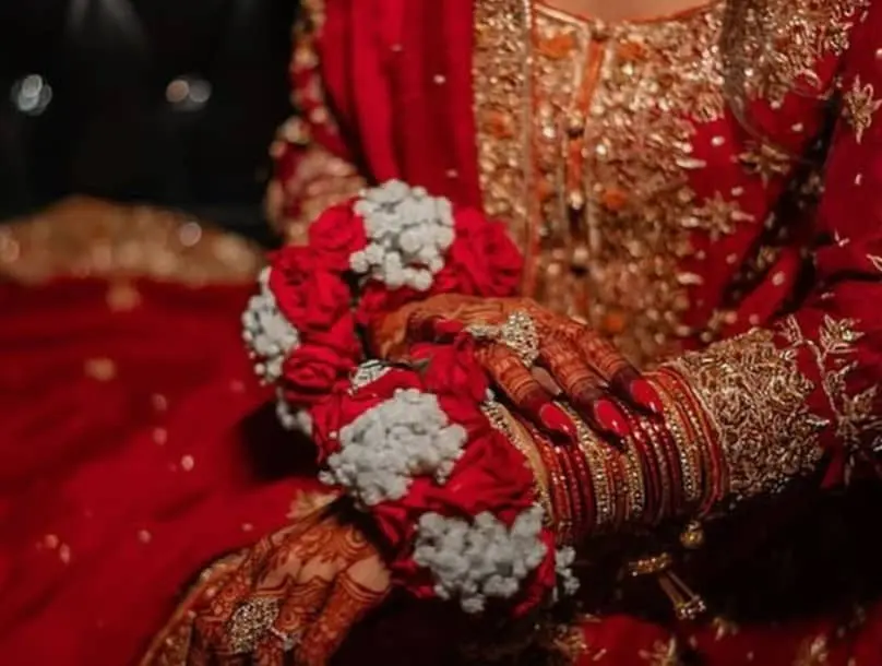 Traditional gajra and floral jewelry arrangement with fresh white flowers for South Asian bridal styling